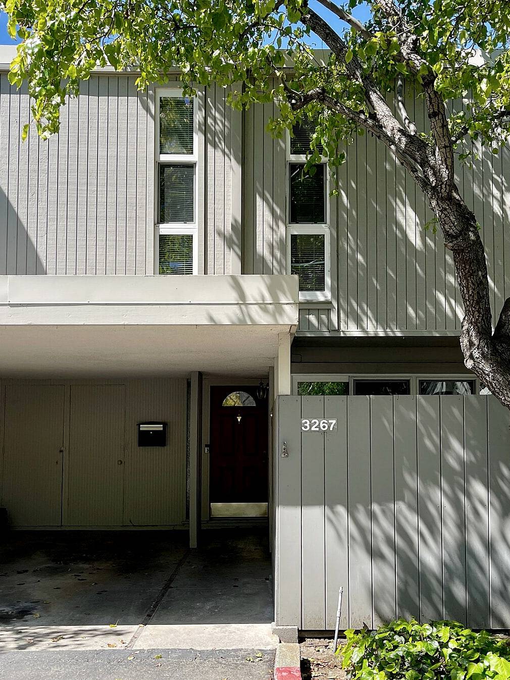 A row of modern townhouses with private entrances